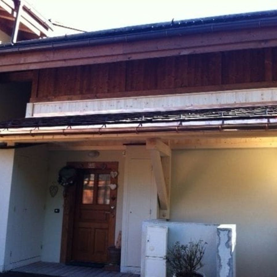 Auvent sur console, couverture tavaillons et zinguerie cuivre